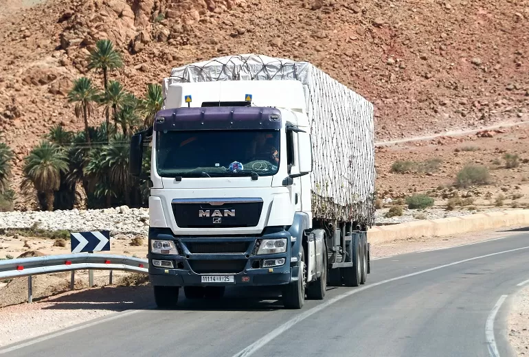 Khenifra Province, Morocco - September 27, 2019: White semi-trailer truck MAN TGS at the interurban road.
